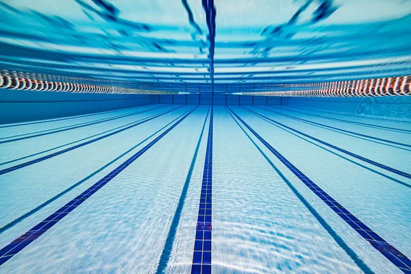 Olympic Swimming pool under water background. — Stock Photo, Image