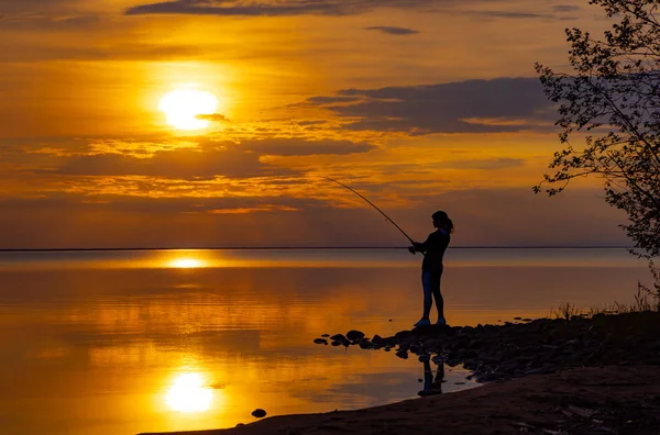 Woman fishing on Fishing rod spinning in Norway. — Stock Photo, Image