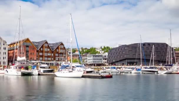 View of a marina in Tromso, North Norway timelapse. Tromso is considered the northernmost city in the world with a population above 50,000. — Stock Footage View of a marina in Tromso, North Norway timelapse. Tromso is considered the northernmost city in the world with a population above 50,000. Video Clip