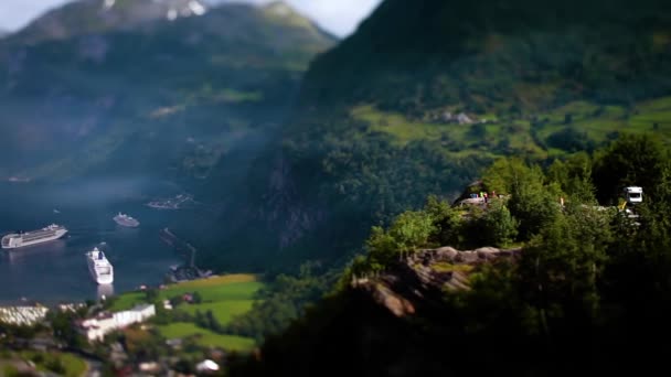 Tilt shift lens - Geiranger fjord, Beautiful Nature Norway. It is a 15-kilometre (9.3 mi) long branch off of the Sunnylvsfjorden, which is a branch off of the Storfjorden (Great Fjord). — Stock Video