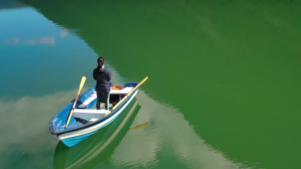 Woman on the boat catches a fish on spinning in Norway. — Stock Video