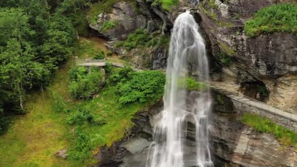 Steinsdalsfossen is a waterfall in the village of Steine in the municipality of Kvam in Hordaland county, Norway. The waterfall is one of the most visited tourist sites in Norway. — Stock Video