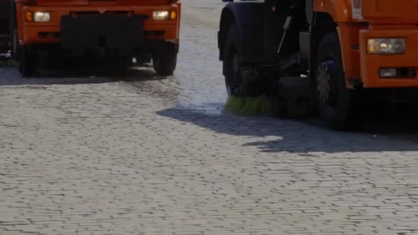 Water tank truck with sweeper cleaning the streets — Stock Video