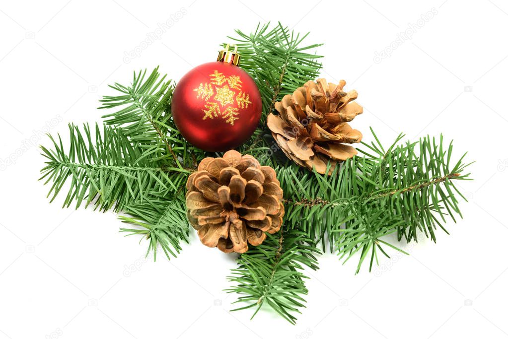 Pine cones with spruce tree branch and red Christmas decoration 