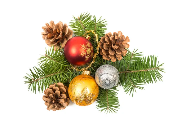 Pine cones with spruce tree branch and Christmas decoration baub — Stock Photo, Image