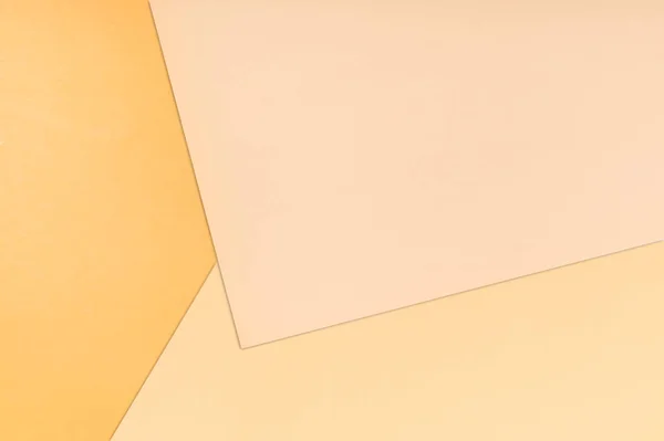 Paper color background. Three warm soft pastel peach color