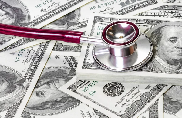 Stethoscope on dollars Financial market health — Stock Photo, Image
