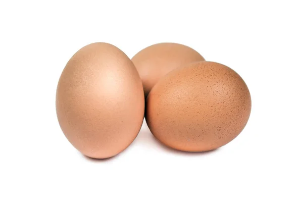 Close up group of three eggs isolated. Brown eggs cut out — Stock Photo, Image