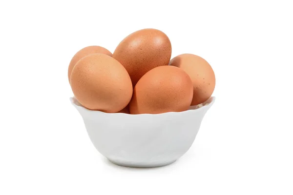 Brown eggs in white porcelan bowl isolated. Clipping path — Stock Photo, Image