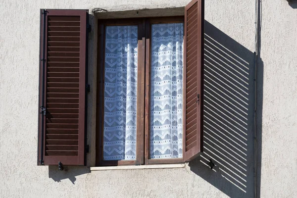 Open window with open shutters