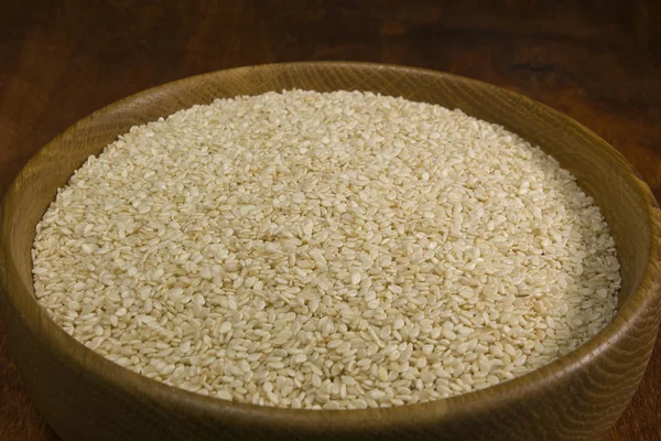 Sesame seeds in a wooden bowl — Stock Photo, Image