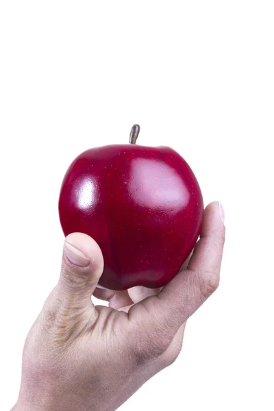 Brazo y mano sosteniendo una manzana — Foto de Stock