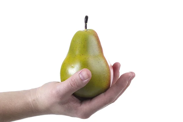 Hand med ett päron — Stockfoto