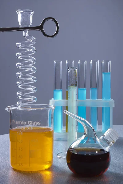 Multicolored liquids in laboratory containers — Stock Photo, Image