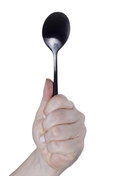 Female hand with a spoon — Stock Photo, Image