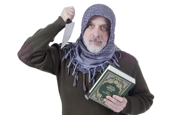 Muslimský muž s Korán a nůž — Stock fotografie