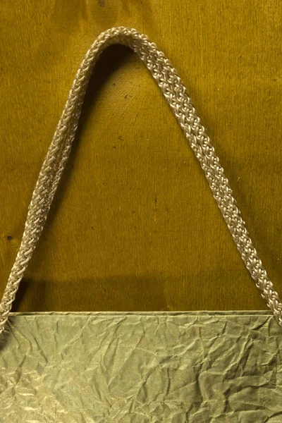 Rope handles from a paper bag