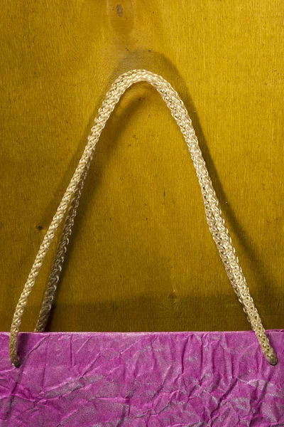 Rope handles from a paper bag