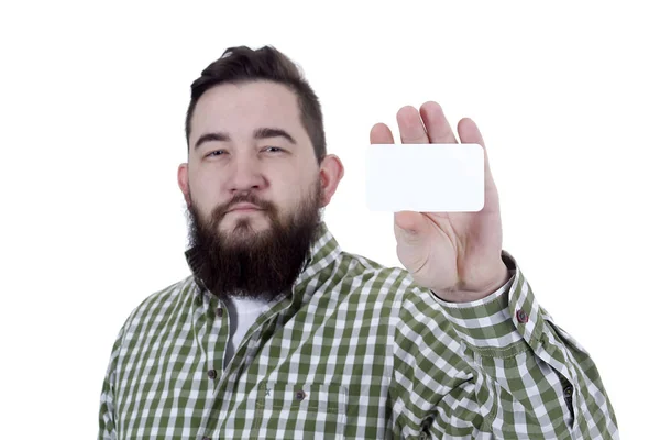 Jeune homme barbu avec une carte de visite dans ses mains — Photo