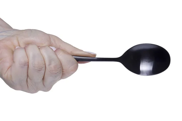 Female hand with a spoon — Stock Photo, Image