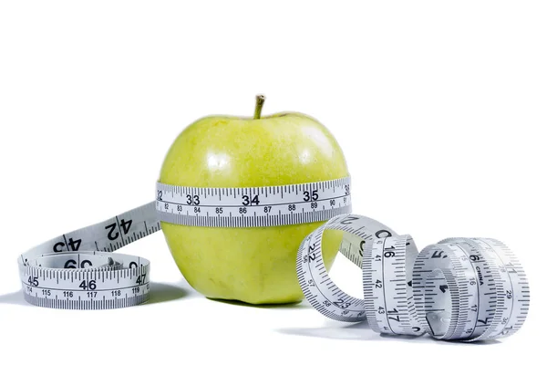 Green apple and measurement tape — Stock Photo, Image