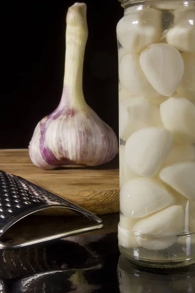 Marinated and fresh garlic with a grater — Stock Photo, Image