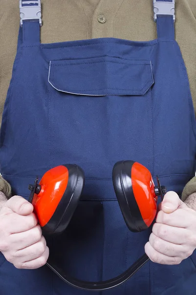 Protective headphones in hands — Stock Photo, Image