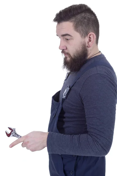 Young man with a wrench — Stock Photo, Image