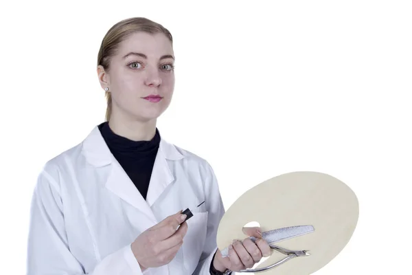 Young woman in a white coat — Stock Photo, Image