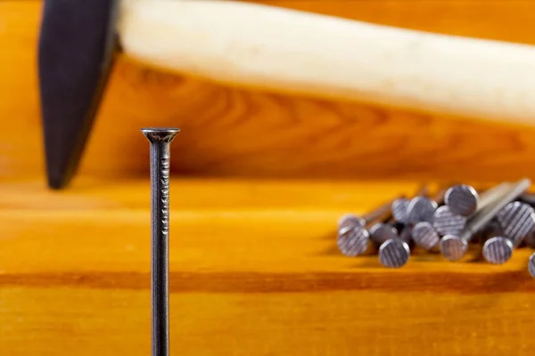 Metal nails and hammer — Stock Photo, Image