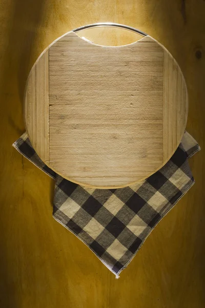 Cutting board on the kitchen table — Stock Photo, Image