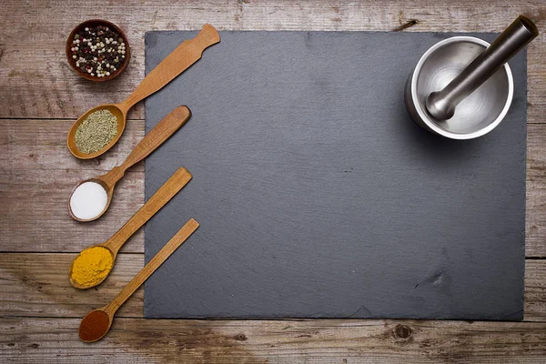 Stone cutting board and spices — Stock Photo, Image