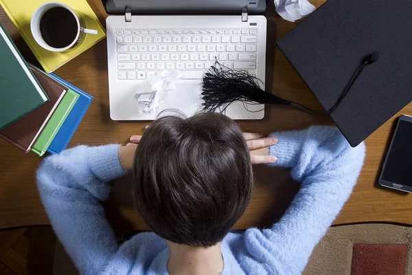 Top view of a girl sleeping behind a computer — Stock Photo, Image