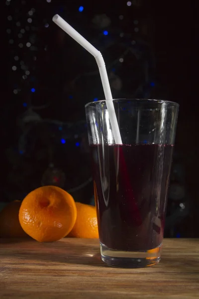 Juice in a glass with a straw — Stock Photo, Image