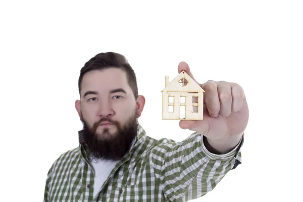 Young man with house model — Stock Photo, Image