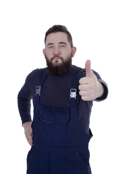 Jeune homme avec une barbe en salopette — Photo