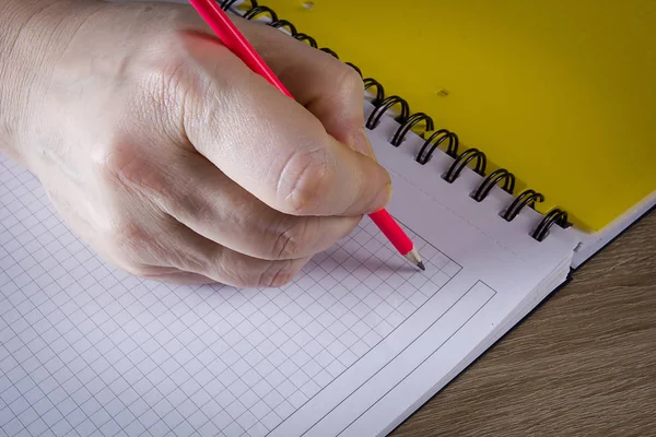 Hand with a pencil Royalty Free Stock Photos