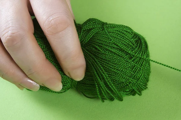 Hands with a skein of thread — Stock Photo, Image