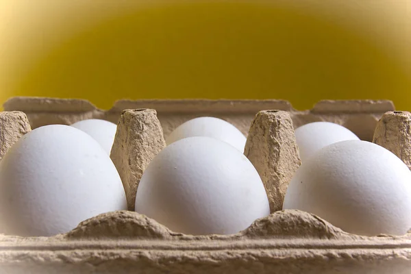 White chicken eggs in egg carton tray