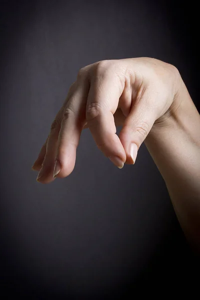 Female hand with closed fingers — Stock Photo, Image