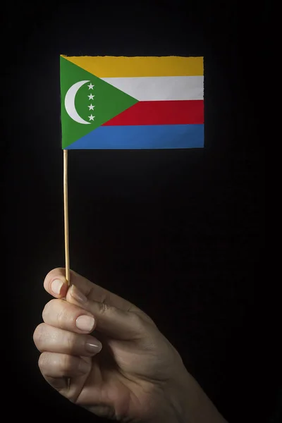 Hand with flag of Comoros — Stock Photo, Image