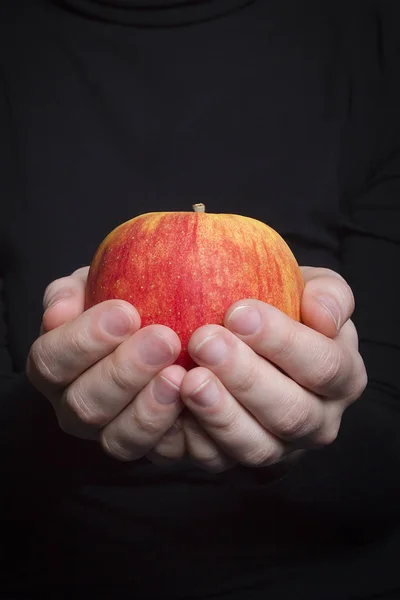 Apple in hand — Stock Photo, Image