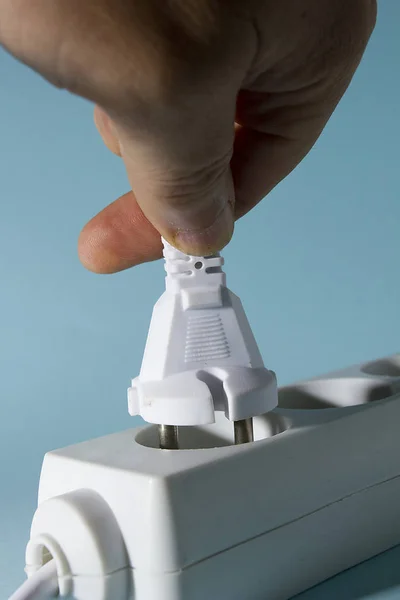 Connecting the plug to a power outlet — 스톡 사진