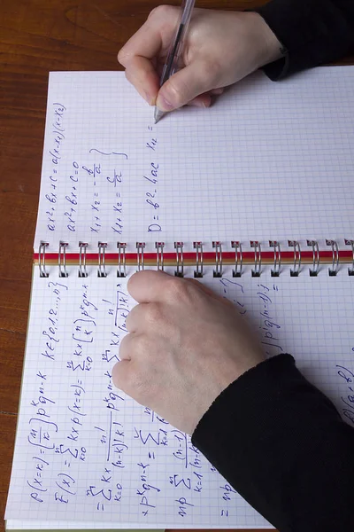 Mathematical formulas in a notebook — Stockfoto