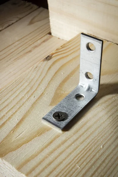Metal corners for fastening wooden boards — Stock Photo, Image