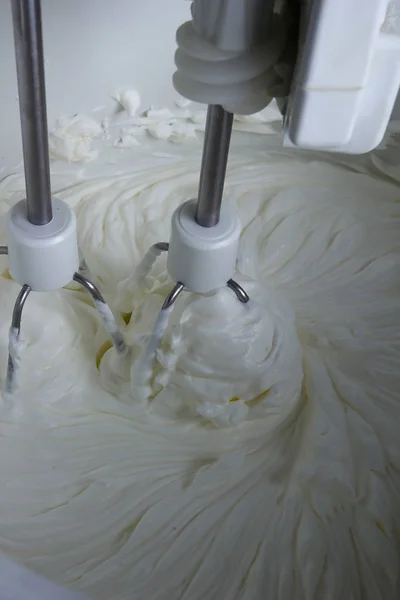 Whipped cream in a mixer — Stock Photo, Image