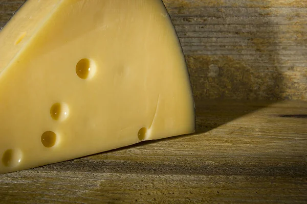 Piece Cheese Old Wooden Background — 스톡 사진