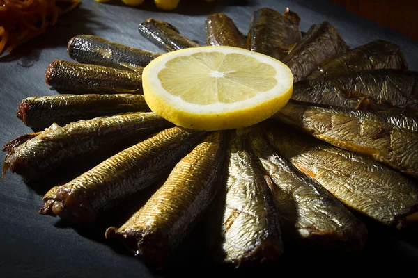 Smoked Little Fish Black Stone Board — Stock Photo, Image