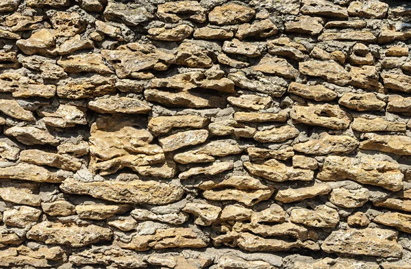 Muur van ruwe stenen shell — Stockfoto