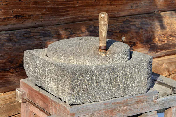 Ancient handmade millstone — Stock Photo, Image